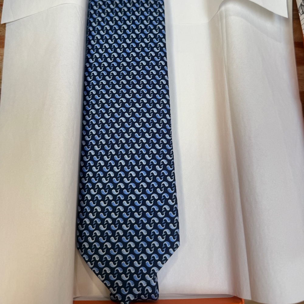 This HERMES Paris neck tie dark blue with a with multi geo print NIB